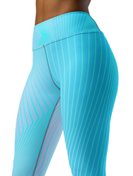 A woman confidently doing a yoga pose while wearing CoastFlex Sport Leggings in a stylish color