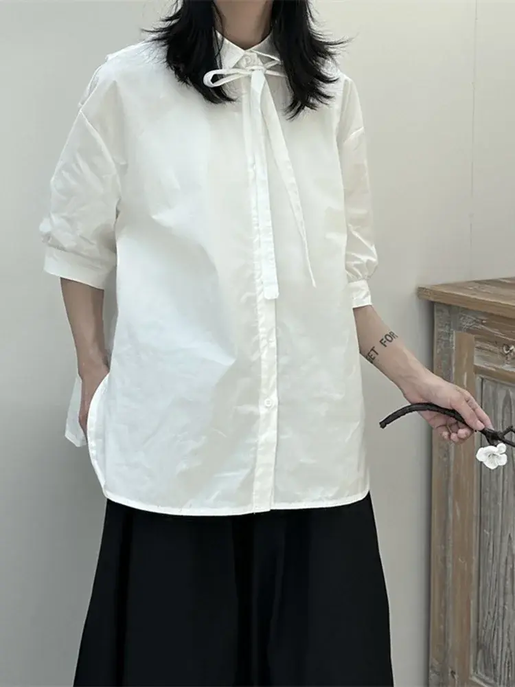 Photo of model in Cusuti black & white color scheme long-sleeve button-down shirt, turn-down collar & single-breasted closure