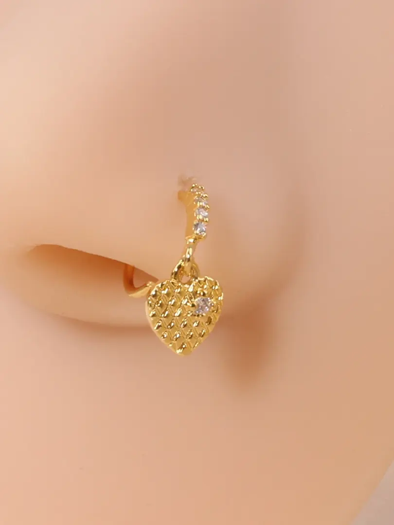 Classic geometric nose stud by Cusuti. Features a sparkling cubic zirconia on a copper base.