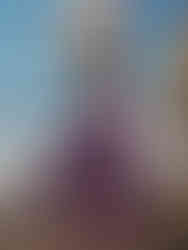 Women's eco-friendly yoga palazzo pants with wrap belt in black, worn by model, made from sustainable materials.