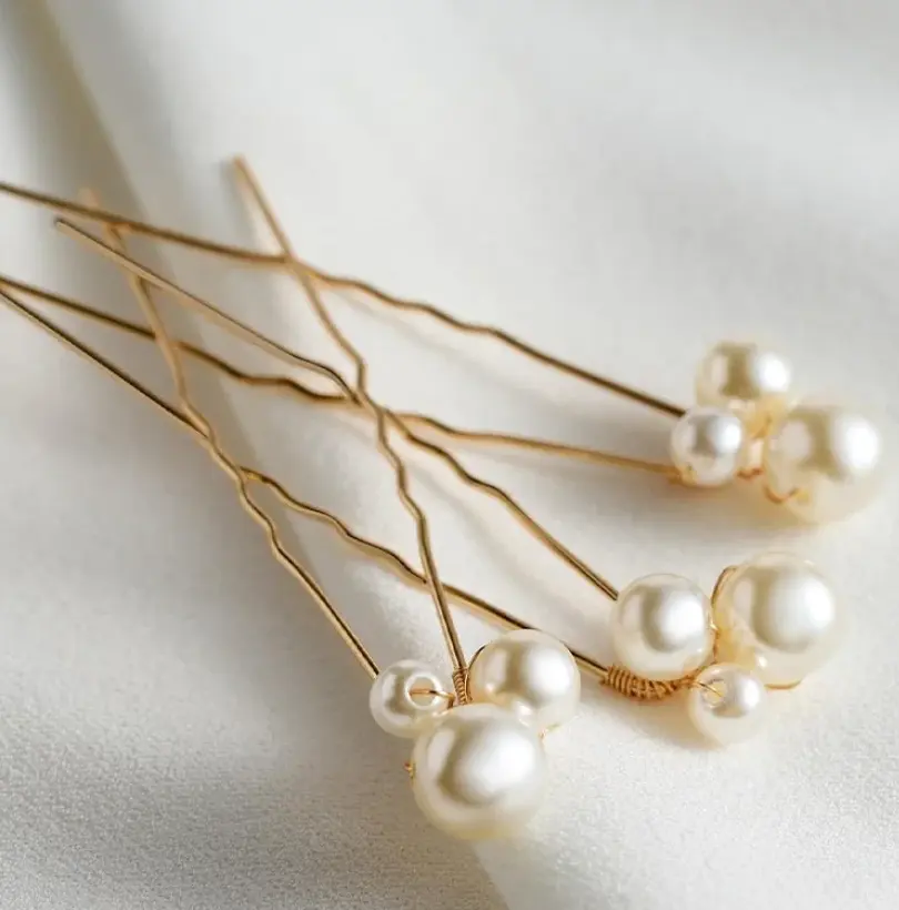 Pair of silver metal hair sticks with a round design Inspired by Cusuti's signature effortless style.