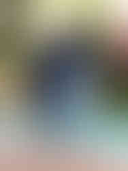 Pair of dark navy skinny jeans with slight fading details, showcasing the form-fitting silhouette.