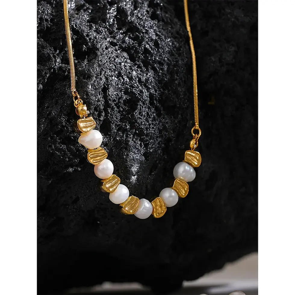 A  jewelry set featuring a freshwater pearl necklace and bracelet on a stainless steel chain with a lobster clasp closur