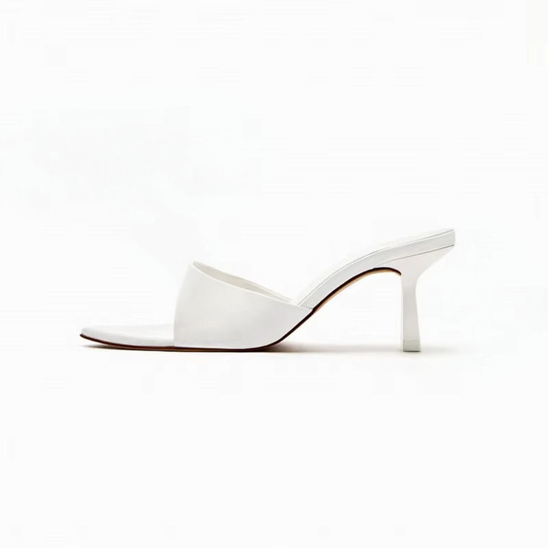 Sabrina Carpenter pointed-toe stiletto mules by Cusuti. These stylish slip-on heels feature a high patent leather upper