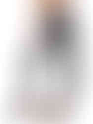 A woman wearing black&white high-waisted compression leggings with a black&white sports bra, working out. Cusuti