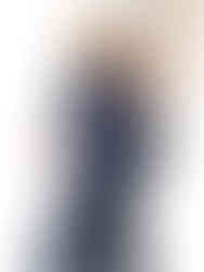 A woman wearing royal blue high-waisted compression leggings with a black sports bra, working out. Cusuti.