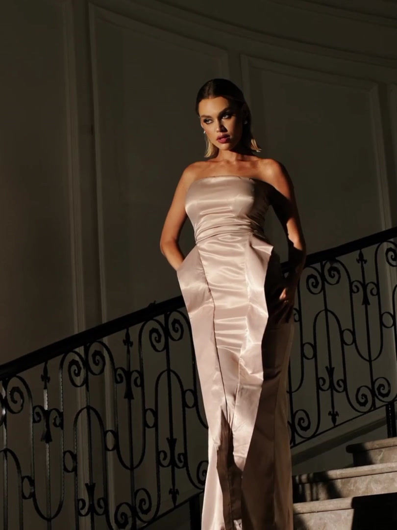 A captivating image of the Gigi Hadid champagne strapless satin maxi dress from Cusuti, showcasing the strapless design,