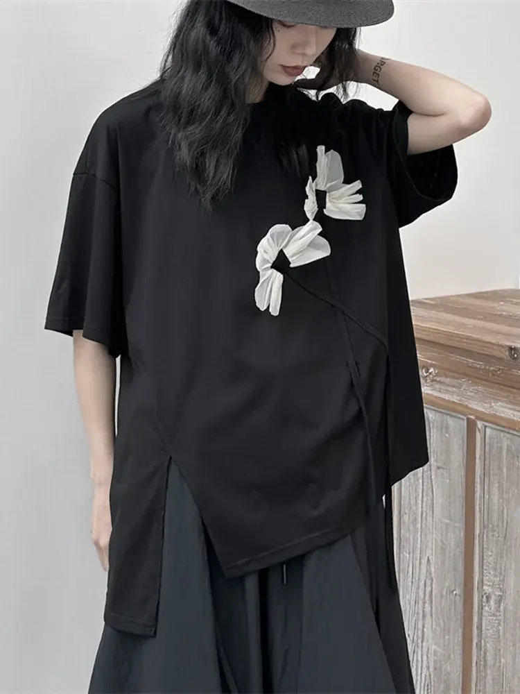 Black crewneck t-shirt made from a cotton-poly blend with a relaxed fit. Cusuti