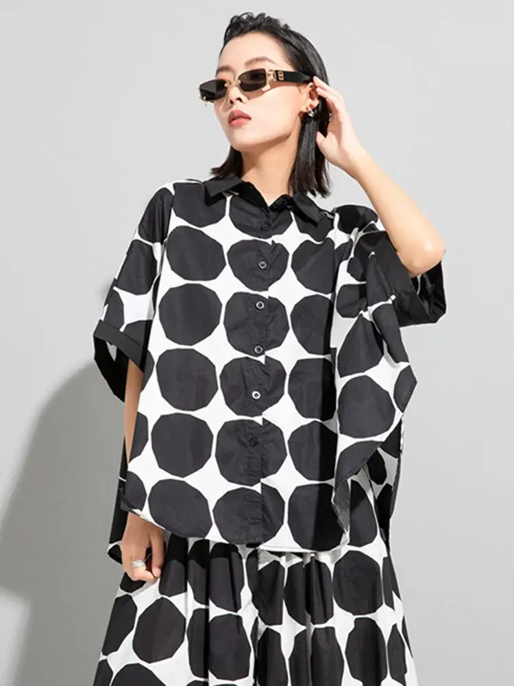 Photo of model in relaxed-fit Cusuti  black and white polka dots Jersey Shirt with turn-down collar & three-quarter sleeves.