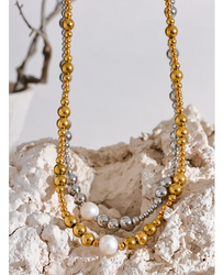 Features a trendy geometric design with a gleaming gold-plated finish, centered with a single, elegant freshwater pearl.