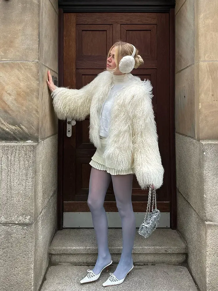 The Miley Cyrus Inspired Faux Fur Jacket, featuring a plush, oversized teddy faux fur design. Available at Cusuti.