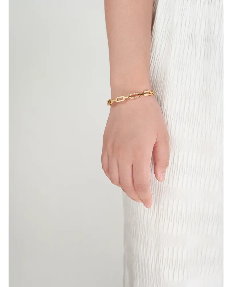 Gold hook bangle bracelet . Modern design, lightweight, polished stainless steel with gold-color plating