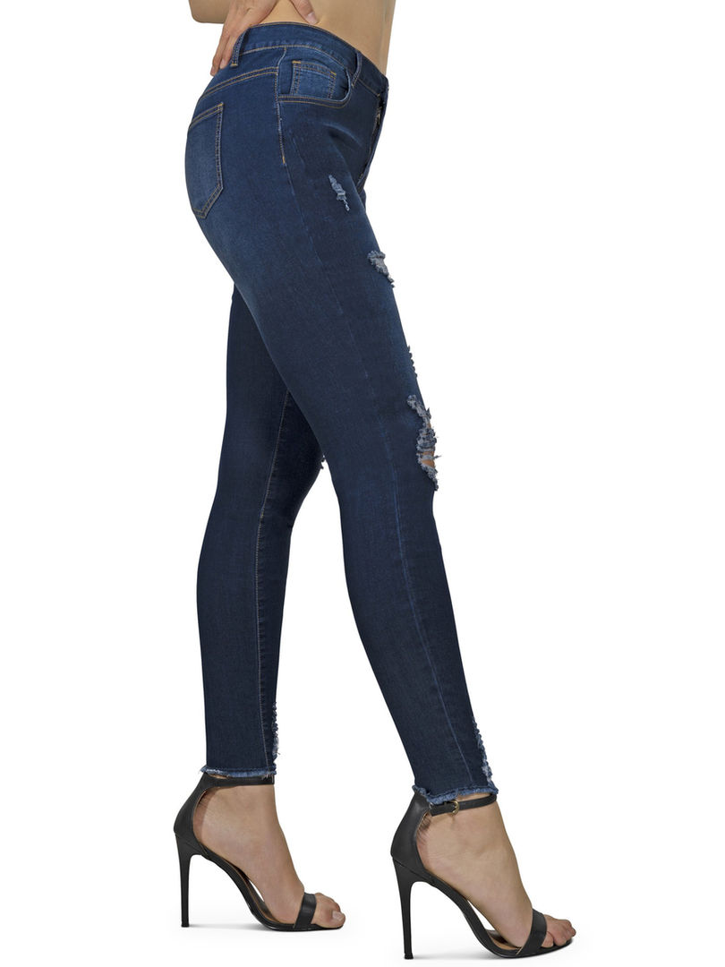 Mid-rise distressed skinny jeans with fading detail, dark wash, and stretch fabric