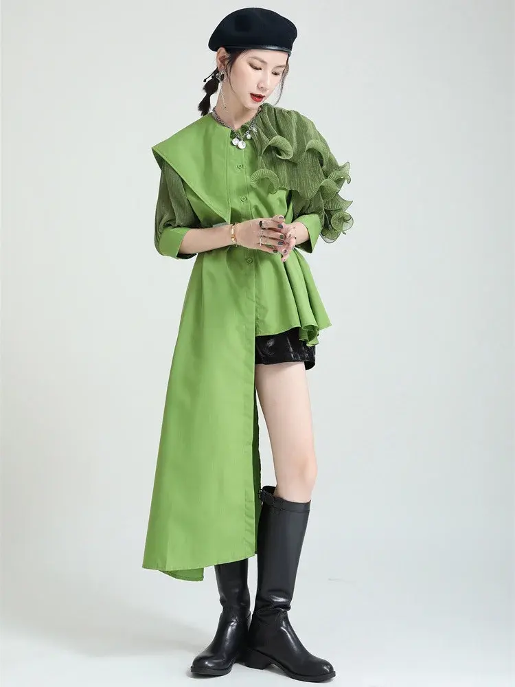 Green, black, and white colorblock casual shirt by Cusuti. Loose fit, midweight synthetic fiber blend, turn-down collar with