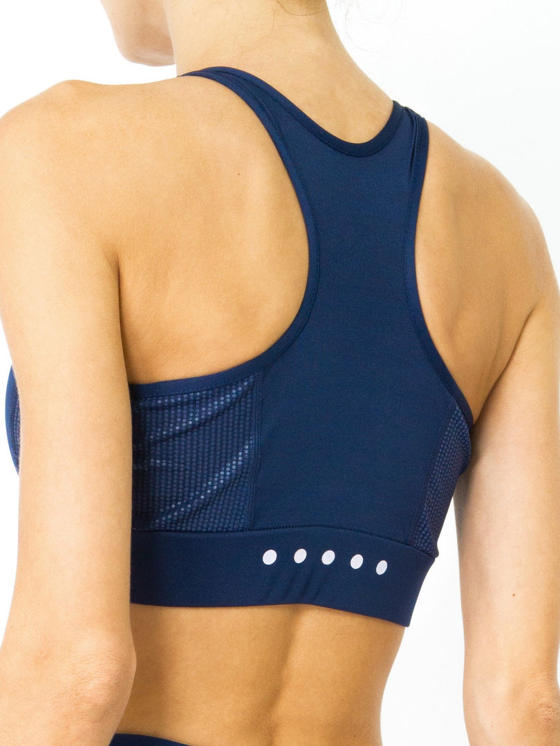 Black high-impact sports bra by Cusuti with racerback straps, removable padded cups, and contrasting details. pen_spark