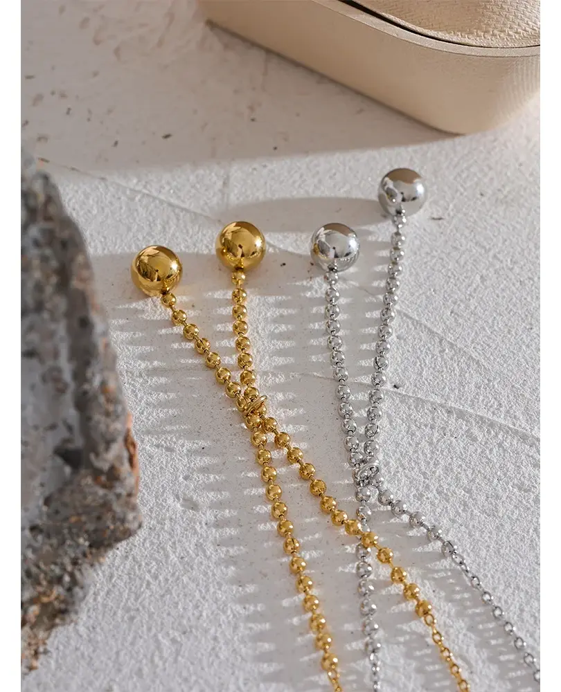 PVD real gold-plated stainless steel in a modern round design. Tarnish-resistant and durable. Multiple variations available