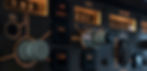 Close-up of an airplane control panel with knobs and displays lit in orange, showing numbers and text like SEL, L NAV, and AUTO.