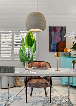 Art-inspired home office featuring fresh greenery, eclectic furniture, and accent decor by Next Chapte