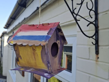 Megan's finished and painted hand-built bird house!