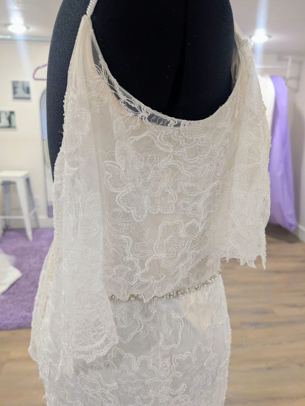 Thumbnail: Jasmine Bridal all lace wedding gown size 18 in ivory featuring a thin crystal bridal belt and flutter sleeves.
