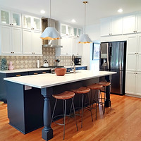 Kitchen has island posts from Timber Wolf Forest Products. Cabinets are White and Blueberry from Fieldstone Cabinetry. Countertop is Et. Calacatta Gold in Suede finish.