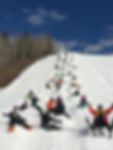 people sitting on moguls at Tawatinaw Valley