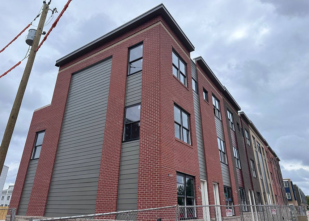 Multi-family building exterior with Hardie siding, soffit, and metal coping