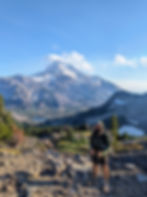 Mt. Jefferson rising through the clouds along the Oregon PCT, seen during a high-mileage day with clear skies and alpine lakes nearby