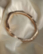 A simple yet tactile and textured gold bangle, perfect for the 'clean girl' aesthetic fashion trend