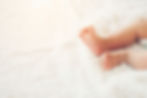 newborn-baby-legs-on-white-bed-2023-11-27-05-23-28-utc.jpg