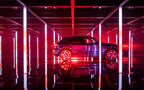 Porsche Macan in a maze of lights at a launch event in Shanghai