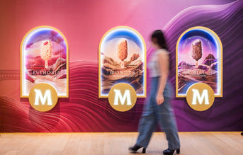 Magnum ice cream event in Singapore, a woman passing by the display and looking shot by Pixel Bureau Singapore