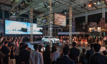 Porsche 911 on display under dramatic spotlight at exclusive launch event