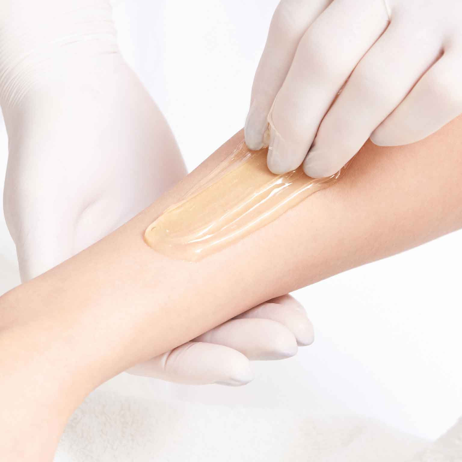 wax being pulled from arm