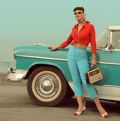 Vintage Girl in front of a classic car