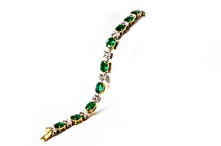 18k Two Tone Bracelet with 8.57 carats of Oval Cut Green Emeralds and 3.52 carats of Diamonds