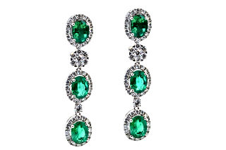 18k White Gold 6.44 carats of oval cut Green Emeralds with 2.49 carats of round diamonds