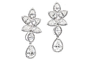 18k White Gold Dangle Earrings featuring two solitaire Pear shaped diamonds with a total weight of 2.40 carats (GIA certified), and 4.25 carats in Marquise, Pear, & Round shaped diamonds