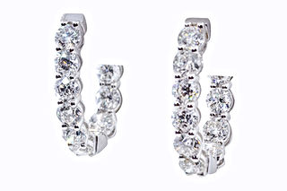 18k White Gold 1.0 inch Oval Hoop Earrings featuring 5.75 carats in round diamonds with extra safety lock