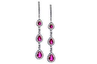 18k White Gold and 2.57 carats of Pear shaped Rubies and 0.62 carats of round diamonds