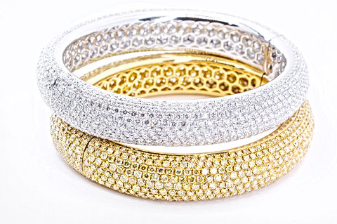 18k White Gold Eternity Bangle Bracelet with 24.50 carats of diamonds pave set
18k Yellow Gold Eternity Bangle Bracelet with 24.80 carats of Fancy Yellow diamonds pave set