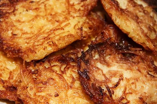 Delicious and Nutritious Potato Pancakes served hot and crispy on a plate.