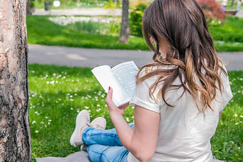 beautiful-young-brunette-sitting-fresh-spring-park-reading-book-closeup-beautiful-young-wo