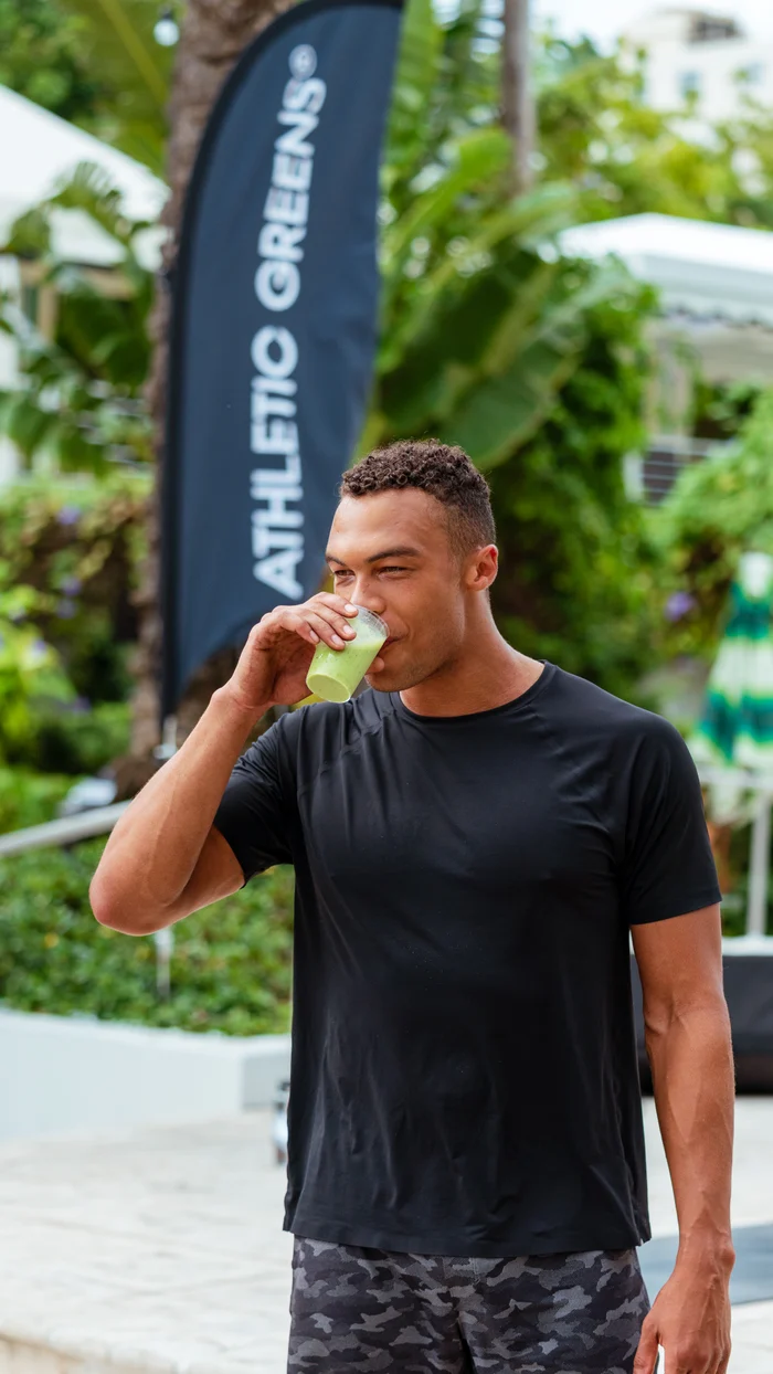 A participant enjoying a drink at an Athletic Greens event in Phase Up’s project archive