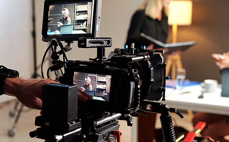 young-man-with-videocamera-standing-in-s