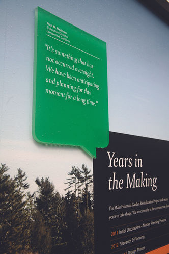 Close-up of green callout panel mounted on a wall titled “Years in the Making,” sharing a quote about the project’s legacy.