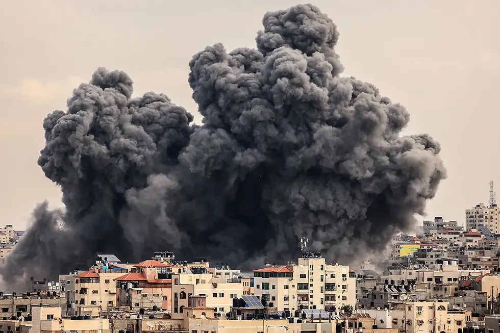 A cloud of smoke rises over Gaza City during an Israeli airstrike