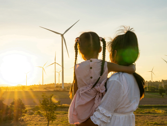 Girls looking toward windmill