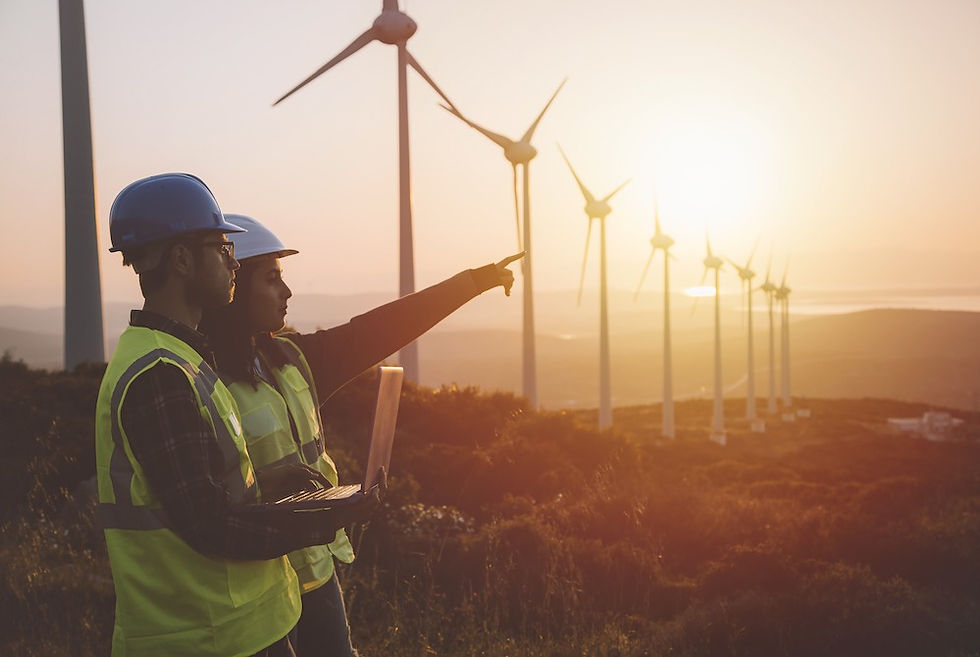 two people by a wind farm