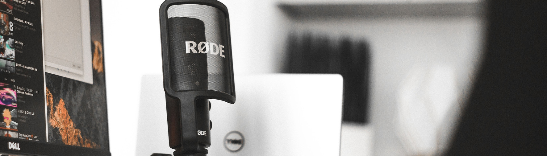 black Rode condenser microphone beside computer monitor_edited.jpg